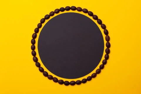 Creative composition of coffee beans in the form of a circle. Stock Photos