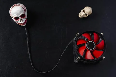 Creative composition, a computer cooler connected to a skull, an image of a c Stock Photos