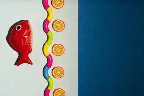 Creative composition of fish and stylized sea, waves, Minimalistic concept, s Stock Photos