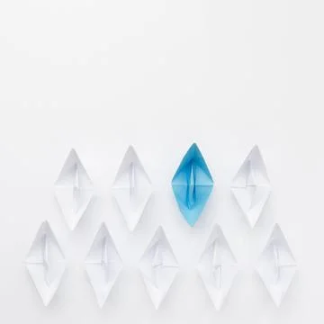 Creative composition individuality concept paper boats. High quality photo Stock Photos