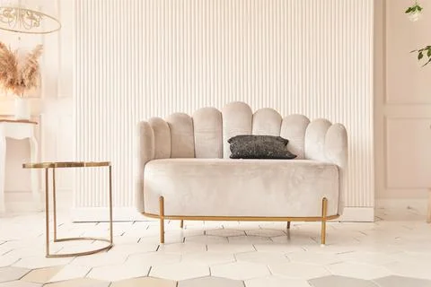 Creative composition of the living room interior with an uneven sofa in a modern Fotos de archivo