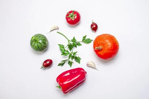 Creative composition of pumpkin, eggplant, bell pepper, sherry tomatoes, ga.. Stock Photos
