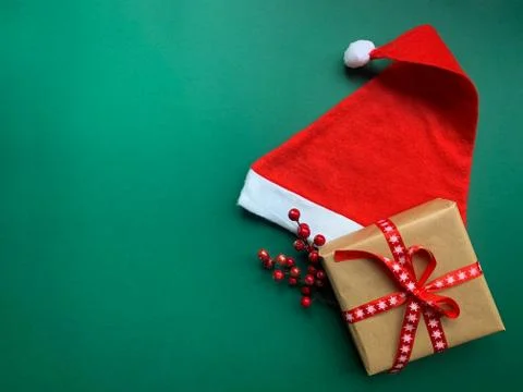 Creative composition with Santa Claus hat and Christmas gift Stock Photos