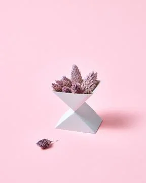 Creative composition of two cardboard boxes with cones on a pink background with Stock-Fotos