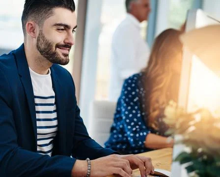 Creative, computer and man in coworking space with smile, business plan or web Stockfoto's