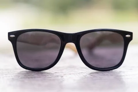Creative concept about poor vision. Landscape focused in glasses lenses over Stock Photos