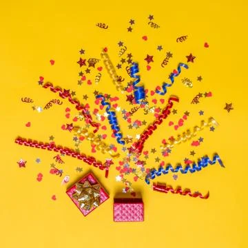 Creative concept with festive decor on yellow background Stock Photos