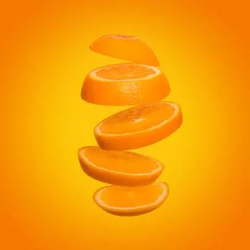 Creative concept with flying orange. Sliced orange on yellow background Stock Photos
