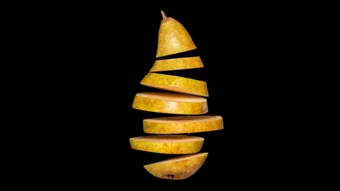 Creative concept with flying pear. Sliced pear isolated on black background. Stock Footage 122303060