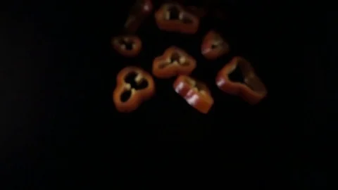 Creative concept with flying red paprika. Sliced floating pepper isolated Stock Footage 82876107