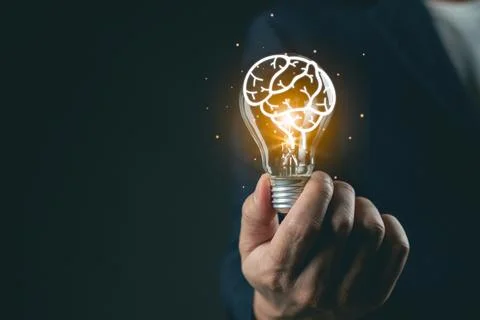 Creative concept of human brain inside light bulb representing ideas, innov.. Stockfoto's