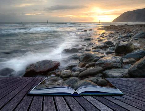 Creative concept image of seascape landscape coming out of pages in magical b Illustrazione stock