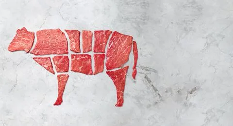 Creative concept marbled meat beef on white marbled background. Top view Stock Photos