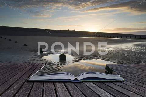 Creative concept pages of book vibrant sunrise landscape reflected in low tid Stock Photos