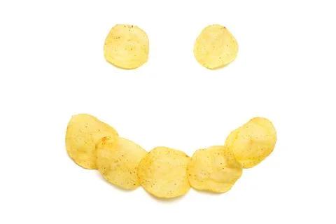 Creative concept with potato chips. The face of a merry clown. Beautiful sm.. Stock Photos