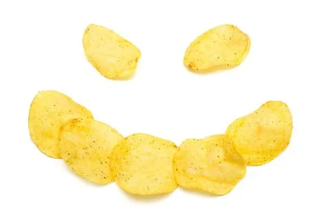 Creative concept with potato chips. The face of a merry clown. Beautiful sm.. Stock Photos