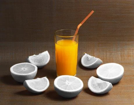 Creative Concept of Sliced White Orange and Juice Drink on Dark Background Stock Photos