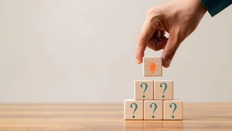 Creative concept. Think different, wooden cube with question mark and light.. 스톡 사진