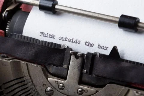 Creative concept. Think outside the box written on an typewriter Stock Photos