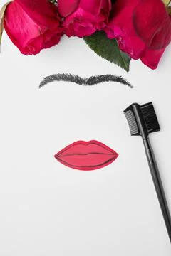 Creative concept of a woman's face. Cosmetics concept on white background. Br Stock Photos