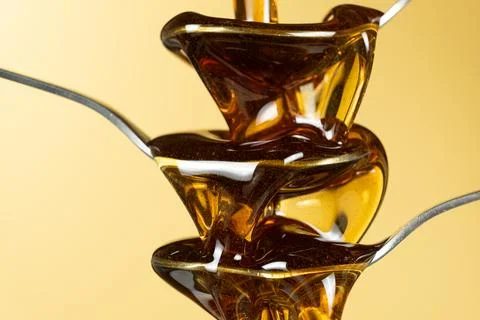 Creative conceptual shot of maple syrup and spoons Foto stock