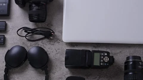 Creative Content Creator Gear Setup with Laptop and Photography Equipment on Stock Footage 337454340