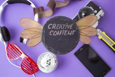 Creative content written with chalk on a black stone tile Stock Photos