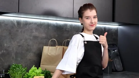 Creative cooking session featuring fresh ingredients in a stylish kitchen Stock-Footage 296318354