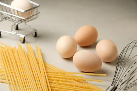 Creative cooking setup with eggs and pasta in a kitchen environment Stock Photos