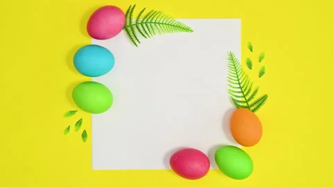 Creative copy space paper card on yellow background with eggs. Stop motion 動画素材 171620977