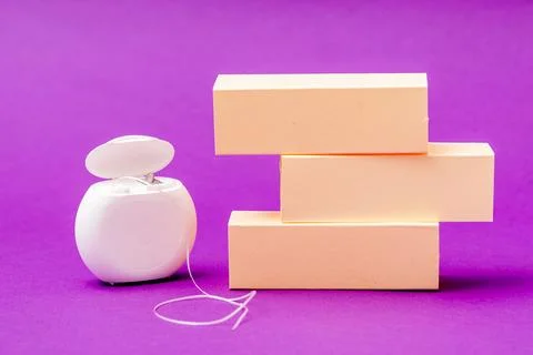 Creative copy space for text on purple background with dental floss and empty Stock Photos