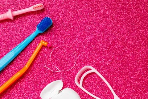 Creative copy space toothbrush, dental floss and tongue scraper, healthy oral Stock Photos