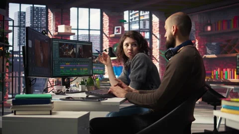 Creative couple working together on video editing software for movie making 스톡 동영상 308607684