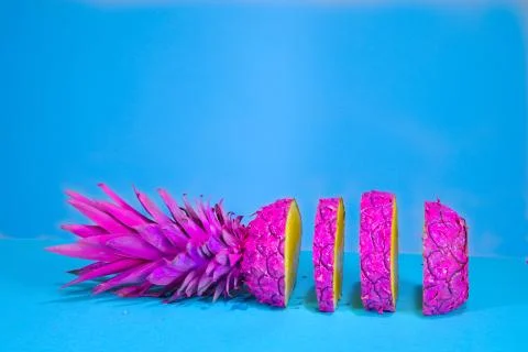 Creative cut Pink Pineapple on Blue background Stock Photos