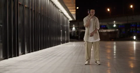 Creative dancer performing on night street Stock Footage 244475214