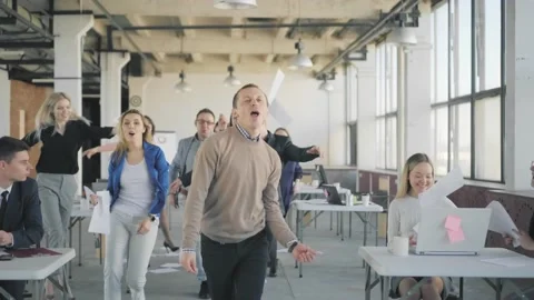 Creative dancing in the office. Employees throw up papers and join the dancers. Stock Footage 165385895