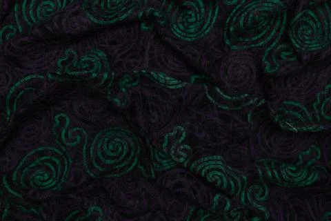 Creative dark fabric with green patterns with textile texture background Stock Photos