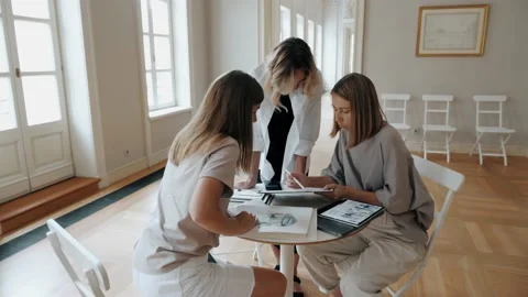 Creative decorators team discussing design event project with woman customer use Stock Footage 213044178