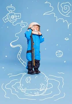Creative design with drawn elements. Portrait of little boy, child in costume of Stock Photos