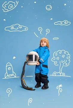 Creative design with drawn elements. Portrait of little boy, child in costume of Stock Photos