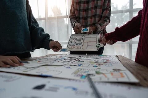 Creative designer choosing color samples for mobile responsive website Stock Photos