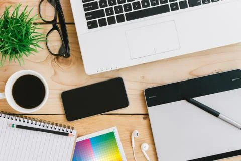 Creative designer desk on top view Stock Photos