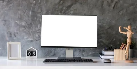 Creative designer desktop with blank white laptop screen with mockup poster.. Stock Photos