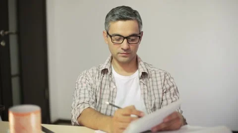 Creative designer sketches in pencil on a sheet of paper Stock Footage