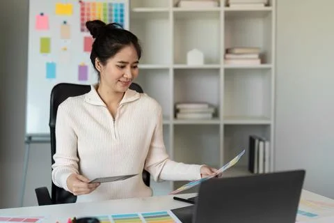 Creative Designer Working on Innovative Project in Modern Office with Color Stock Photos