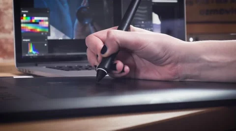 Creative designer working on project using the tablet and stylus Stock Footage 62241483