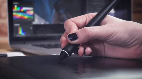 Creative designer working on project using the tablet and stylus Stock Footage 62241502
