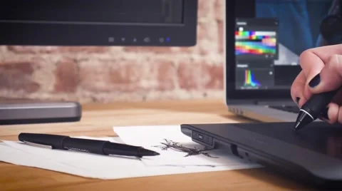 Creative designer working on project using the tablet and stylus Stock Footage 62241534