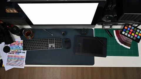 Creative designer workplace from above with computer graphic tablet and color Stock Photos