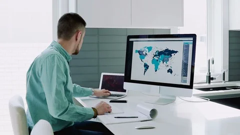 Creative designer works for a large computer at home Stock Footage 104322053